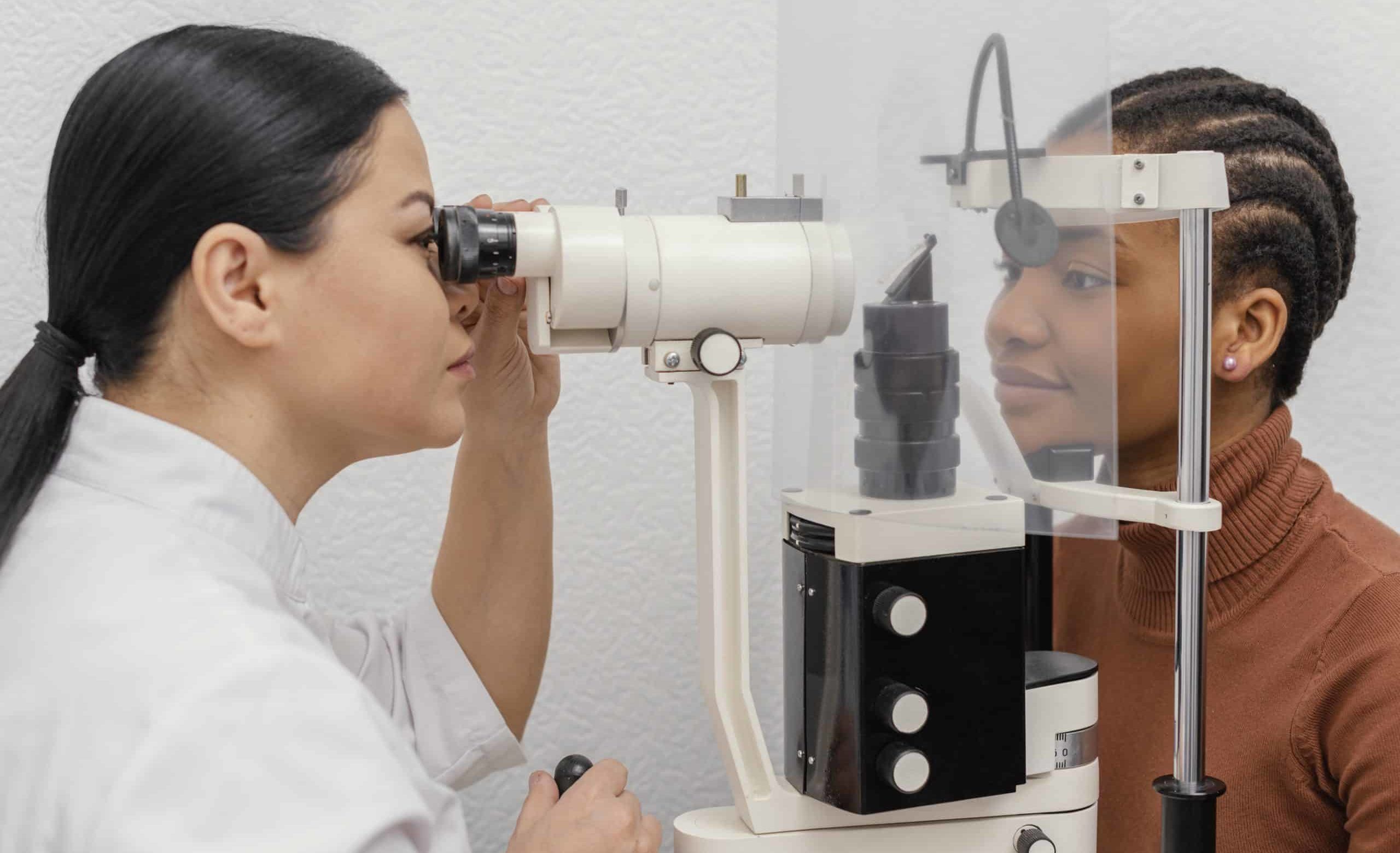 An ophthamologist examines a pediatric patient's eye during an routine eye appointment scheduled on the Complete Eye Care of Medina website.